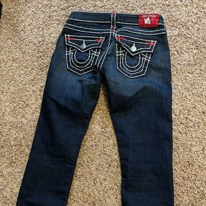 Super cute low waisted true religion jeans with red stitching!